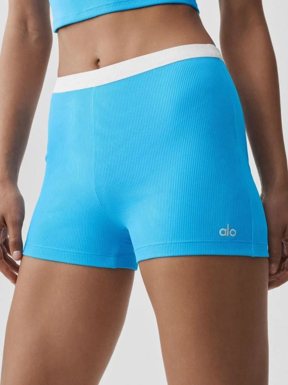 ALO Yoga Ribbed High-Rise Bike Shorts in Bright Blue with White Waistband